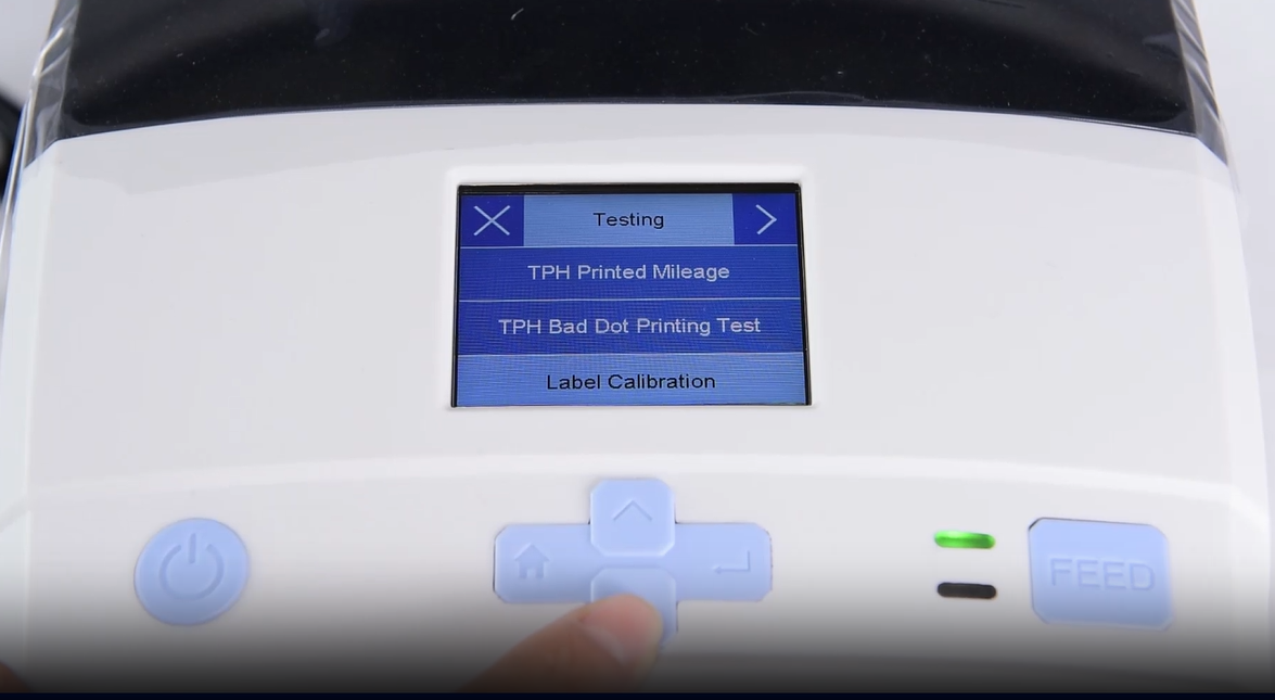 ألف close-up of a machine's digital interface showing a testing menu.